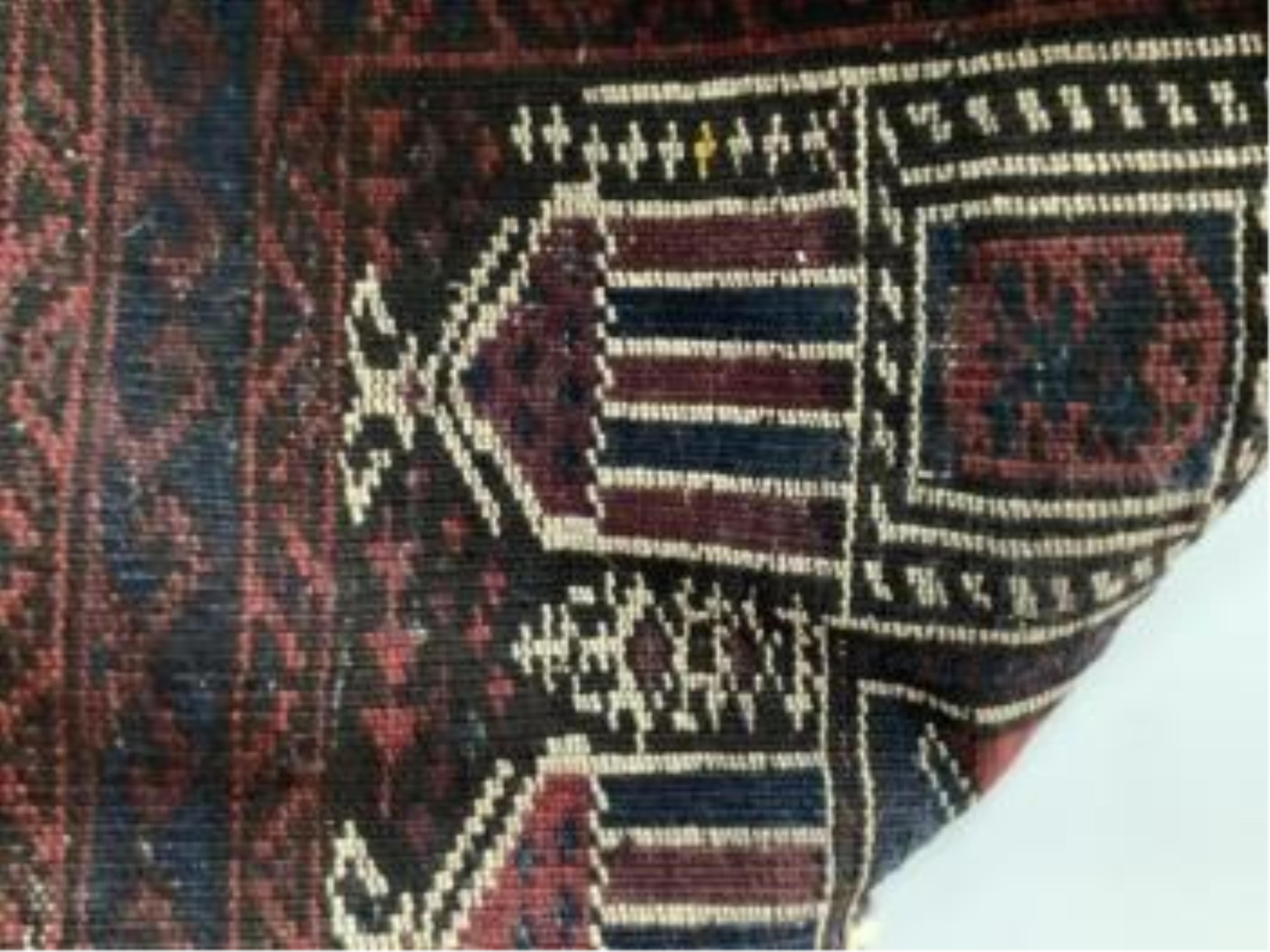 An antique Caucasian geometric rug, 250 x 140cm, together with a Belouch prayer rug, 130 x 78cm. Condition - poor